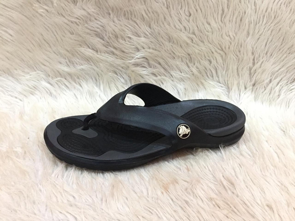 black and gray Crocs flip-flops