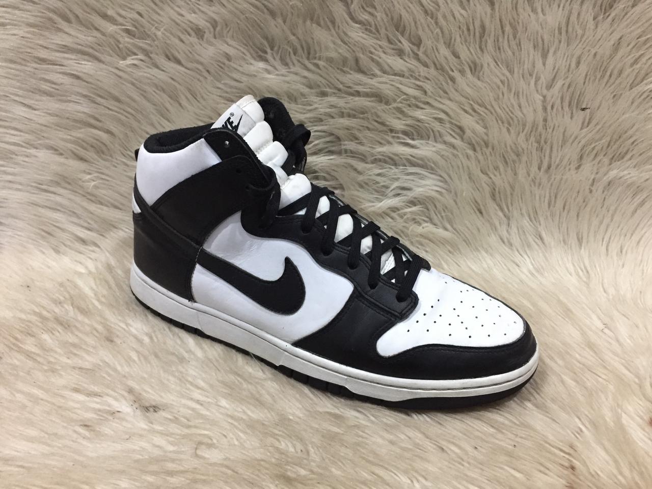 Black and white sneaker on a fur surface