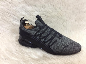 Gray and black sneaker on a white fur background